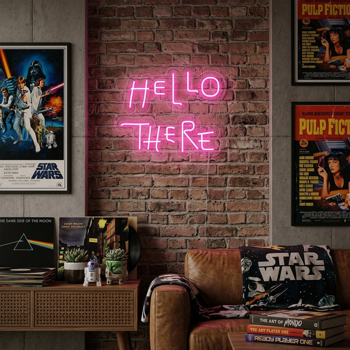 A "Hello There" neon sign glowing brightly on a textured wall in a modern living room setting.