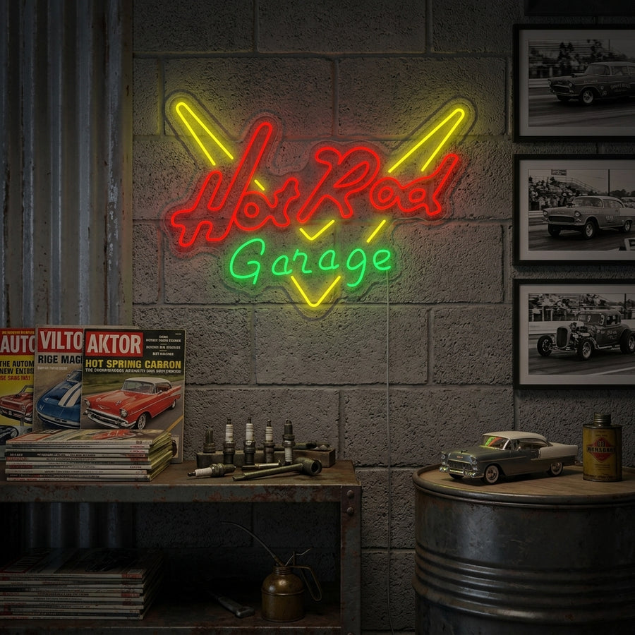 A vibrant 'GARAGE HOT ROD' neon sign with a vintage car design glowing brightly on a brick wall in a well-appointed home garage setting.