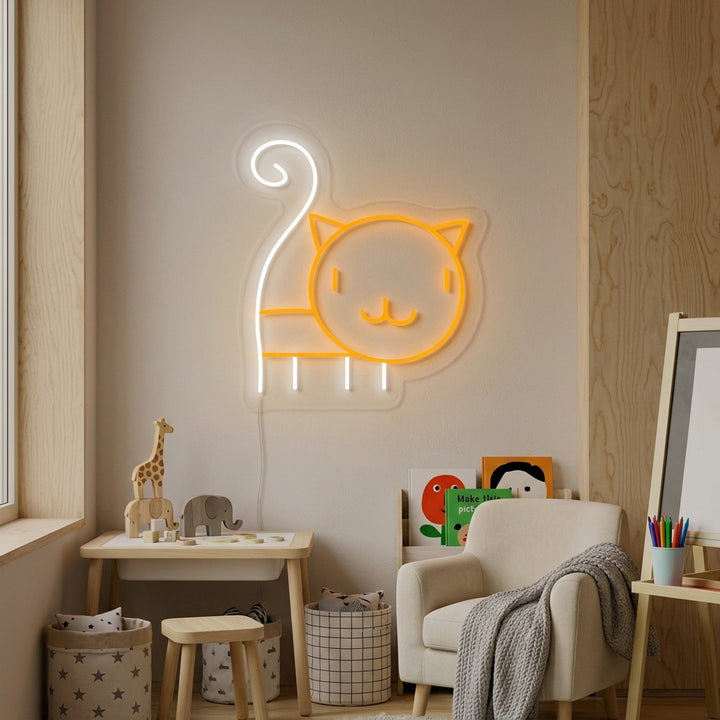 Adorable cat kitty neon sign glowing with a warm pink light on a textured wall in a tastefully decorated kids' bedroom, illuminating plush toys and books on nearby shelves.