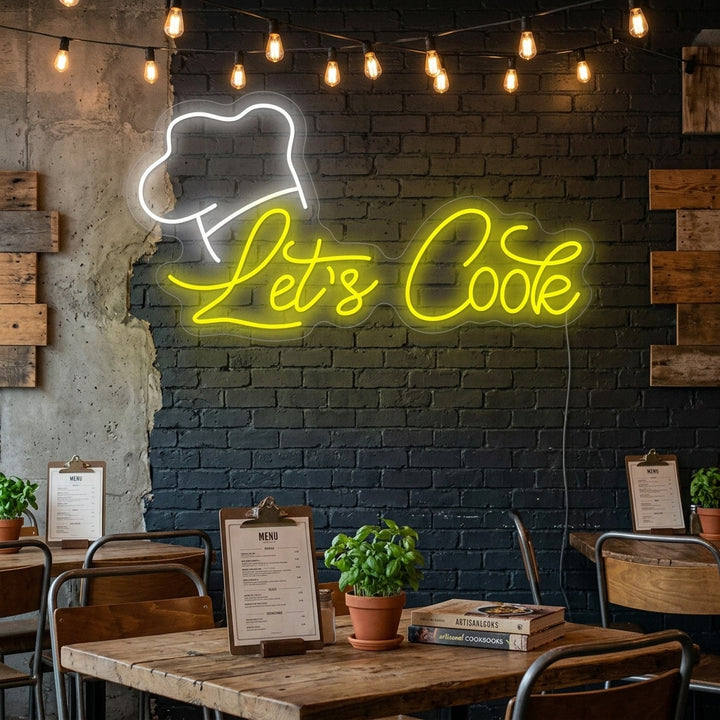 Let's Cook neon sign glowing red on a modern kitchen wall above a wooden countertop with cooking ingredients
