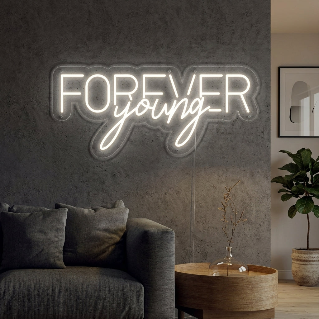 A vibrant 'Forever Young' neon sign mounted on a clean wall in a modern bedroom setting.