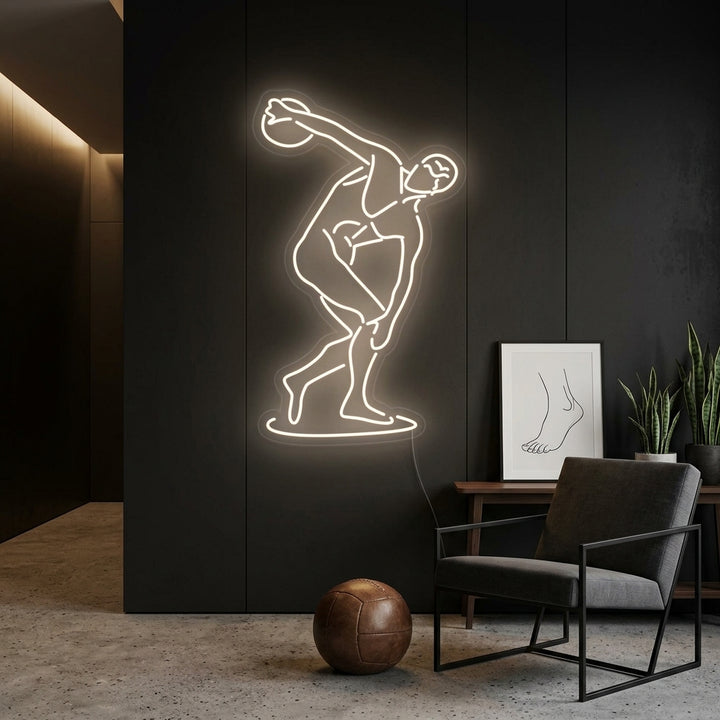 A lifestyle shot of The Diskobolus of Myron Neon Sign illuminating a sophisticated room, mounted on a textured wall.