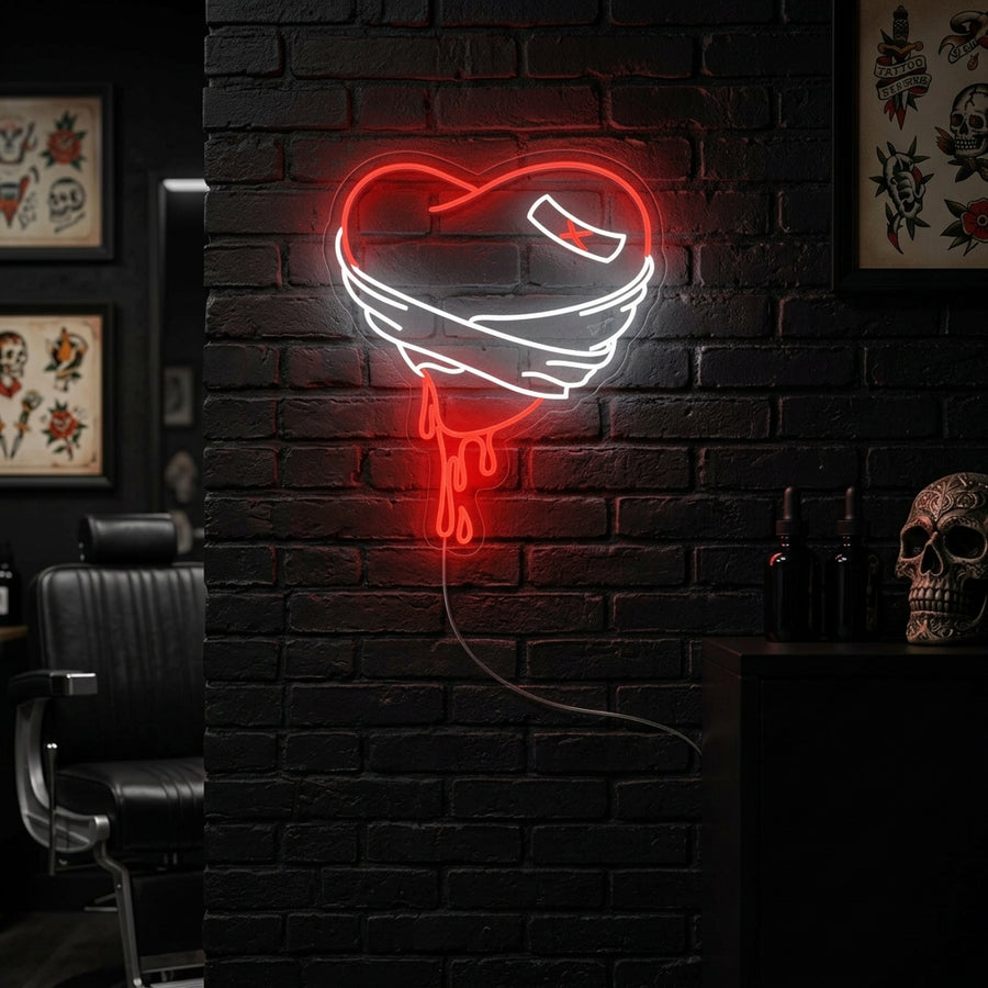 A vibrant red bleeding broken heart neon sign displayed on a dark accent wall in a stylish living room.
