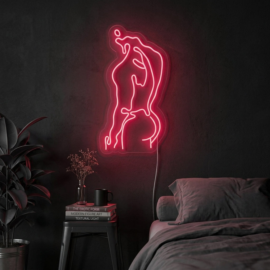 A vibrant red 'Strong Man Body Human Male Body' neon sign glowing on a textured brick wall above a gym weight rack, showcasing its fitness-focused appeal.