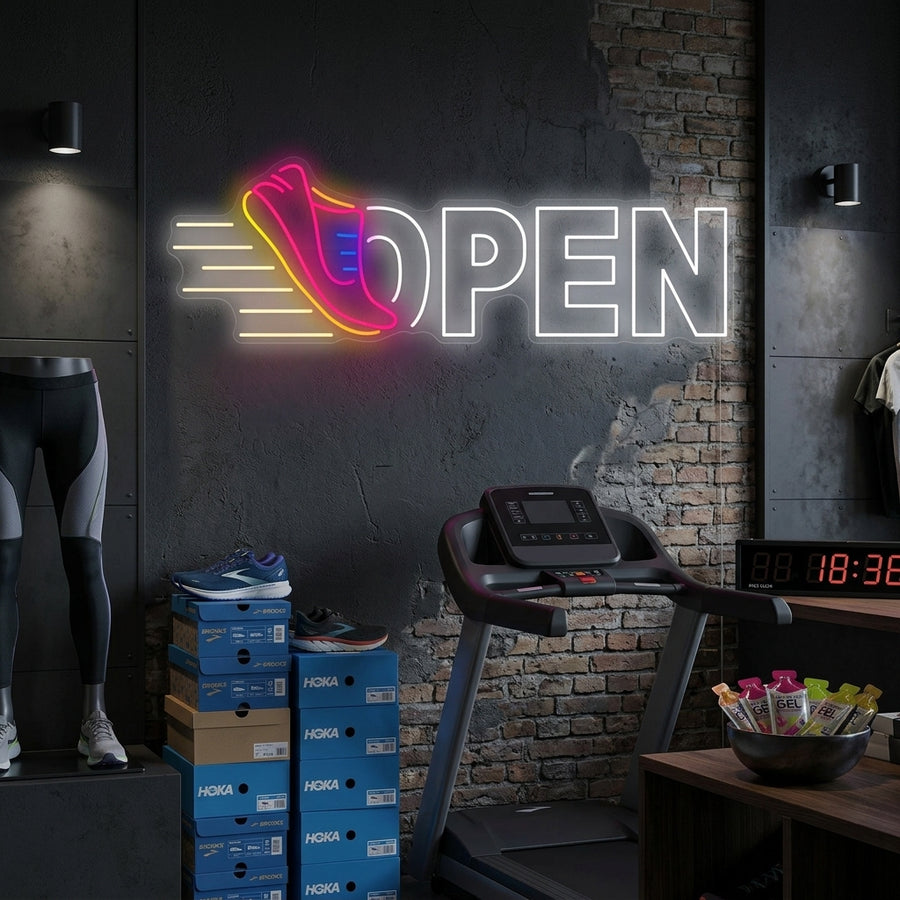 Vibrant Running Shoes Open neon sign glowing on a textured brick wall in a lifestyle setting.