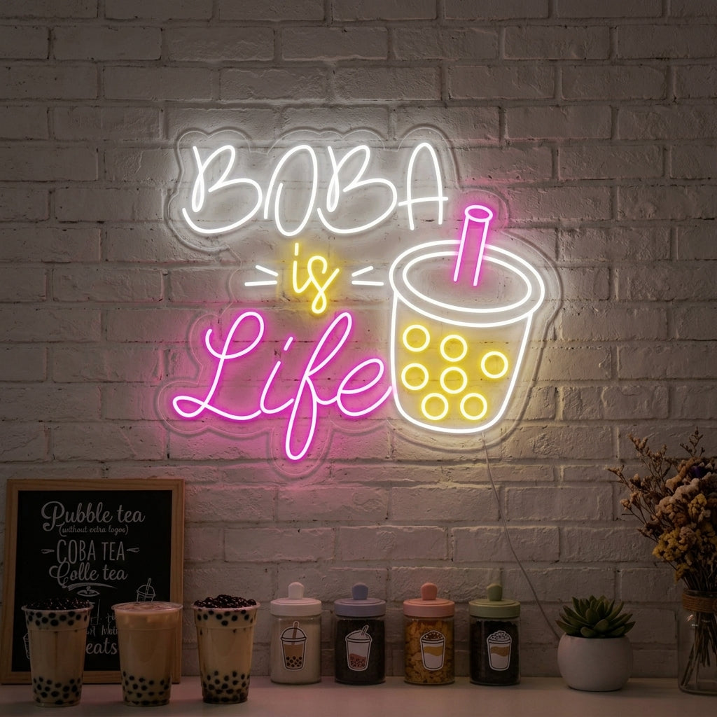 A vibrant 'Boba is Life' neon sign glowing brightly on a textured wall in a cozy cafe setting.
