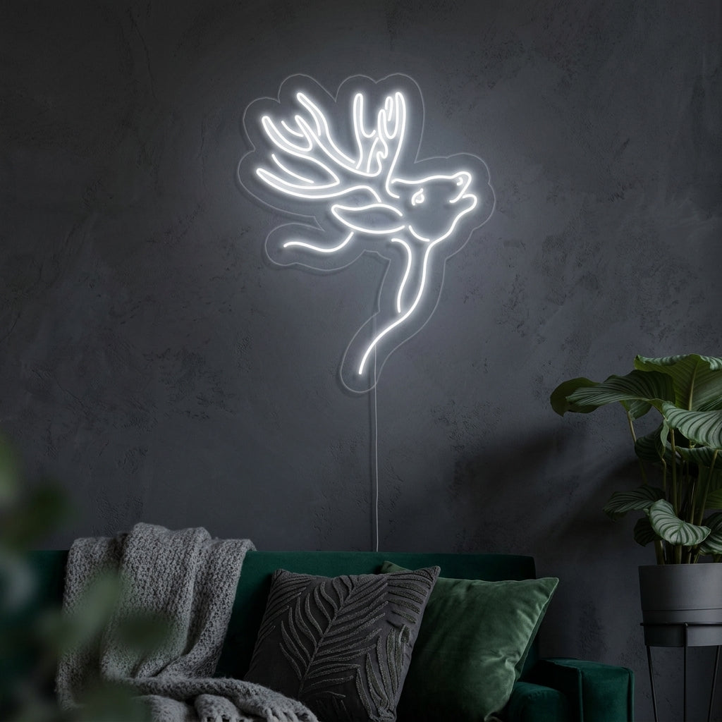 A lifestyle shot of the David Deer neon sign illuminated on a textured wall in a modern living room setting.