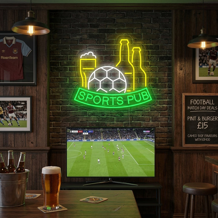 A Football Beer Sports Pub neon sign displaying a pint glass and a soccer ball, mounted on a brick wall in a lifestyle setting.