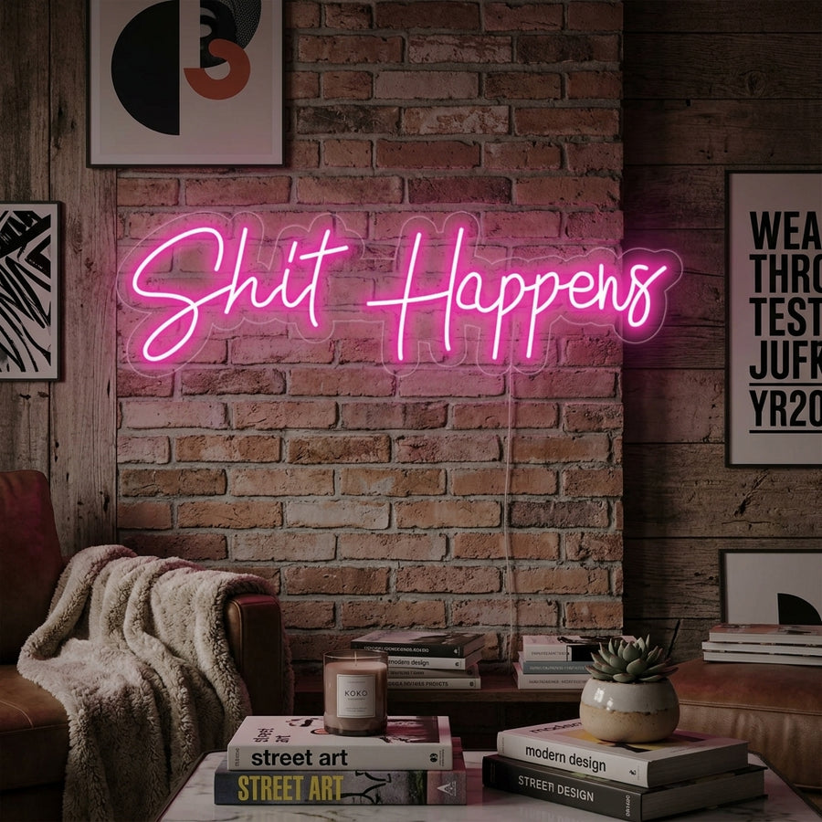 Handmade "Shit Happens" neon sign glowing brightly in a stylishly decorated room, creating a cool and inviting atmosphere.