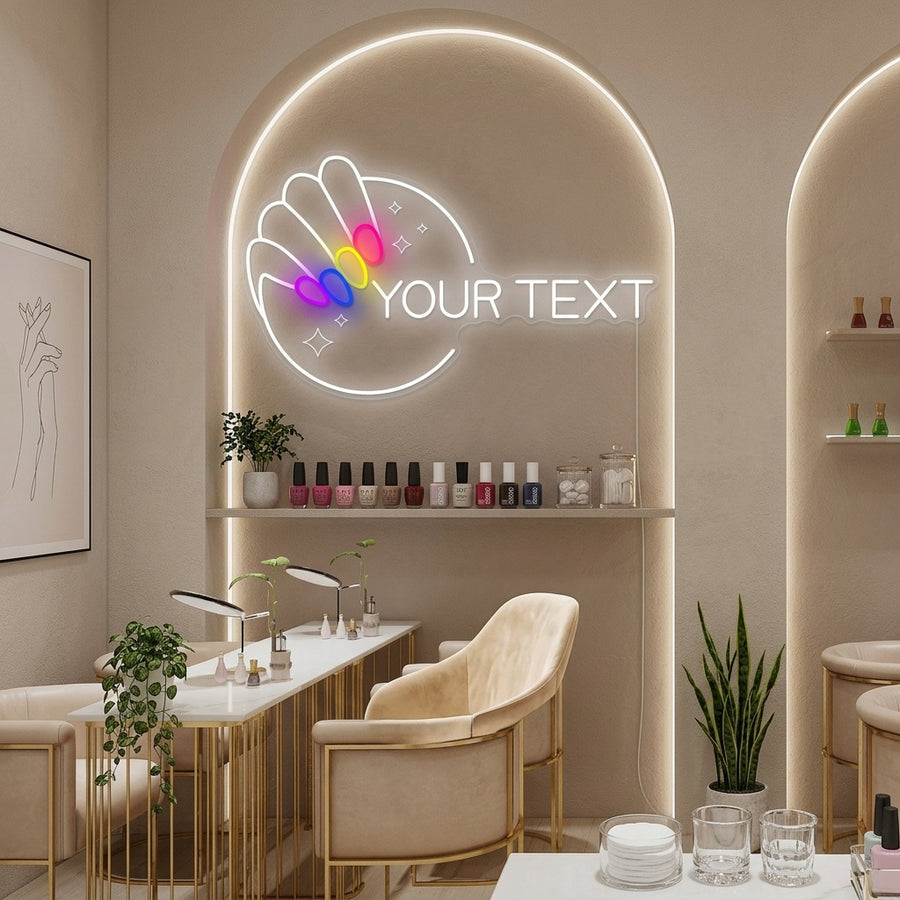 A lifestyle photo showing the Custom Nail neon sign lit up, mounted on a wall above a manicurist station in a busy nail studio. The warm glow creates a welcoming ambiance.
