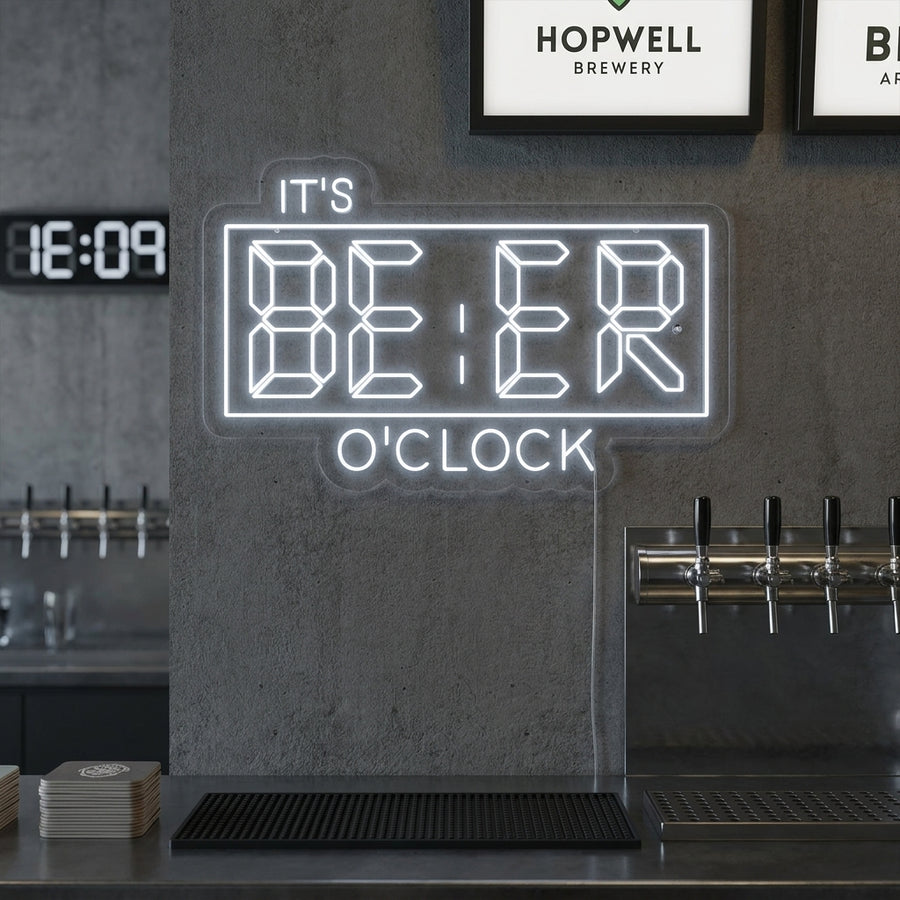 It's Beer O'Clock Bar neon sign, stylized with a martini glass, illuminated in red and yellow above a dark bar with beers.