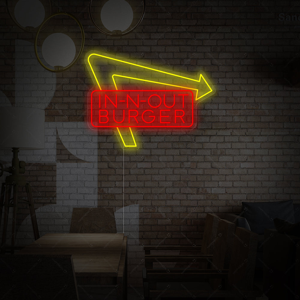 In-N-Out Burger logo neon sign glowing against a brick background