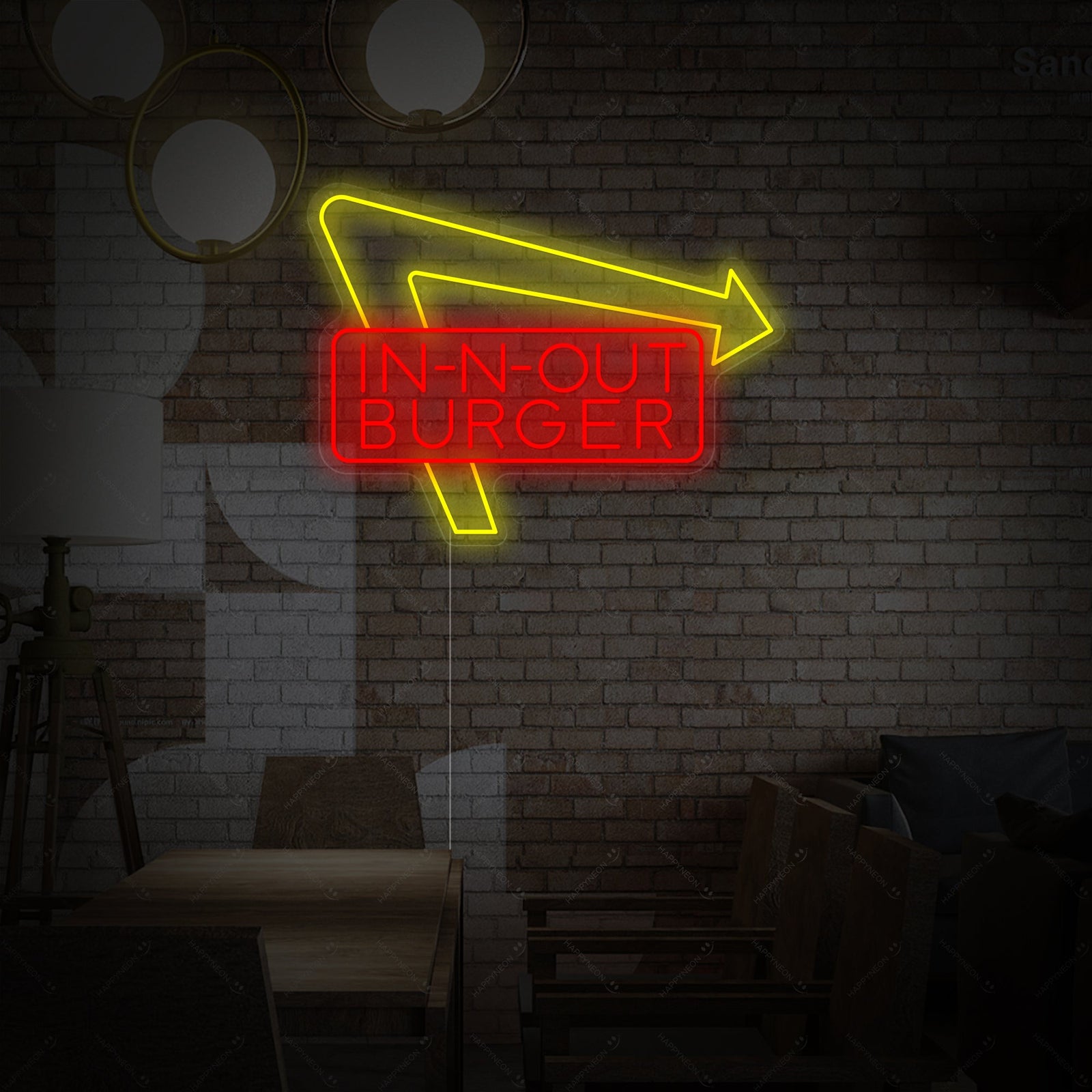 In-N-Out Burger logo neon sign glowing against a brick background