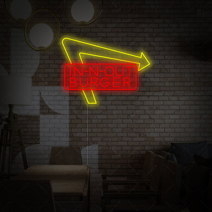 In-N-Out Burger logo neon sign glowing against a brick background
