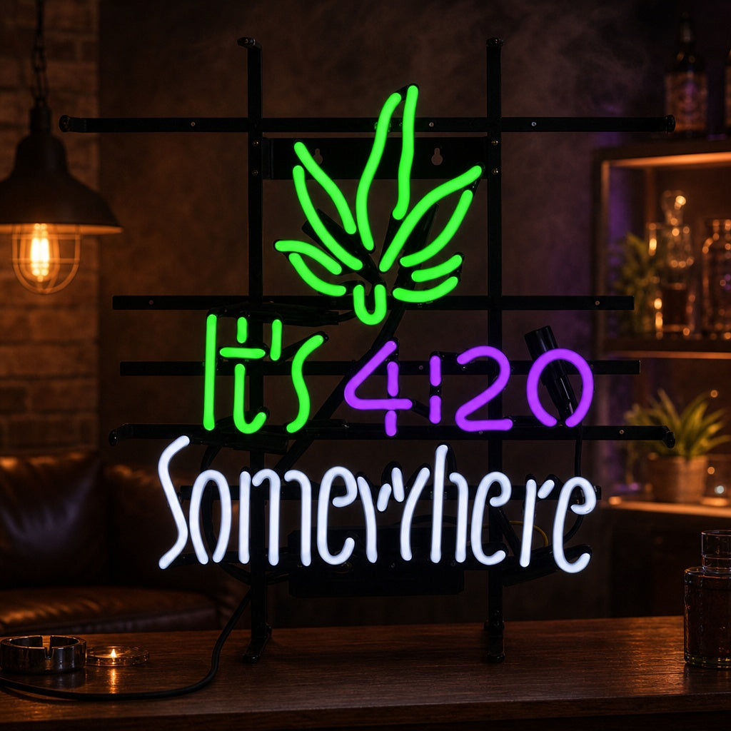 A glowing red and green neon sign mounted on a black wall that reads 'Its 420 Somewhere' with a marijuana leaf icon.