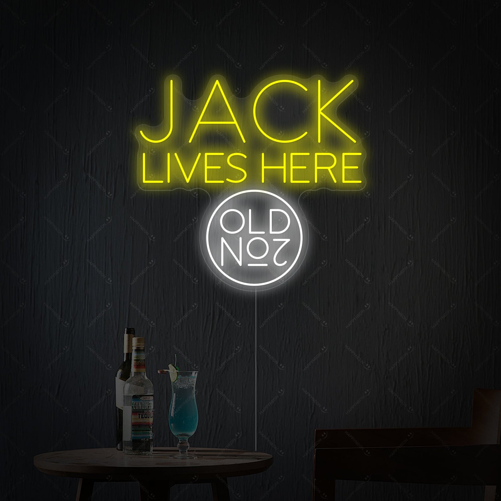 A bright Jack Lives Here and Jack Whiskey Neon Sign glowing in a dark, atmospheric home bar setting.