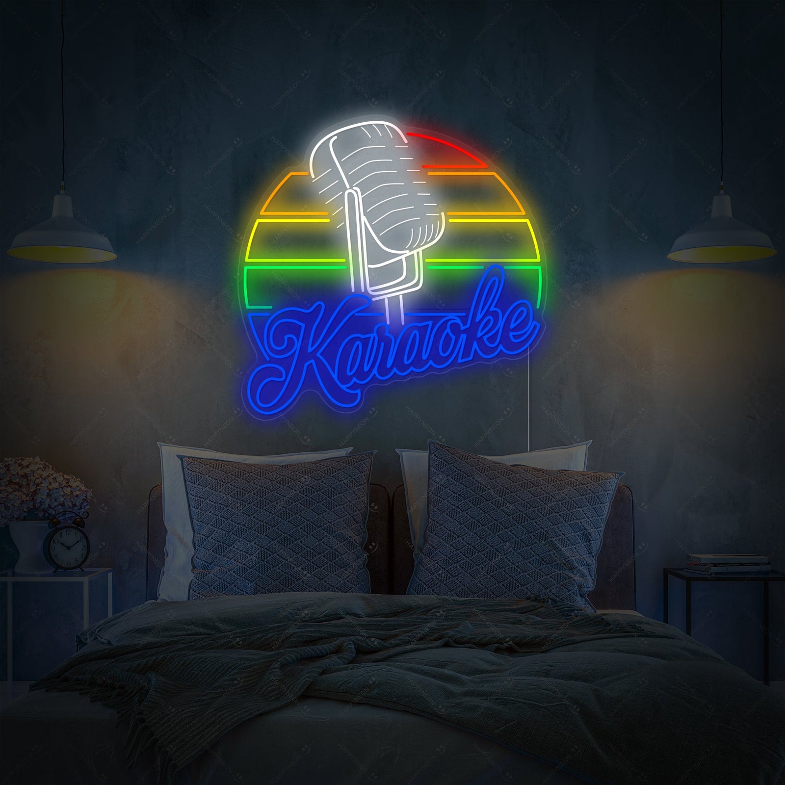 A colorful 'Karaoke' neon sign glowing above a bed in a modern bedroom, featuring a microphone icon and bold lettering against dark teal wall paneling.