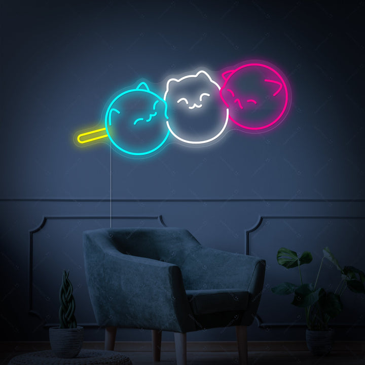 A close-up view of the Kawaii Japanese Dango Cat neon sign, showing the detailed tubing structure and the clear acrylic backing board.