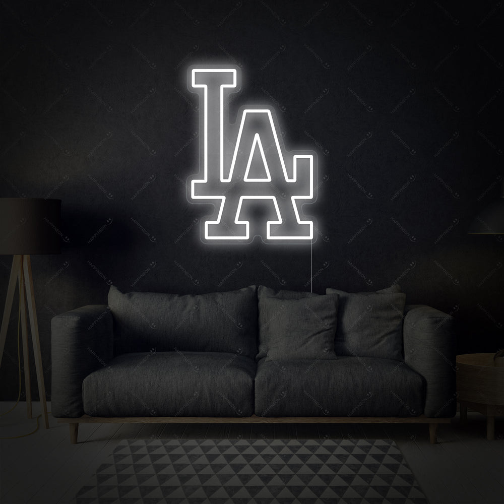 A glowing 'LA' neon sign with the iconic interlocking letter design for baseball fans.