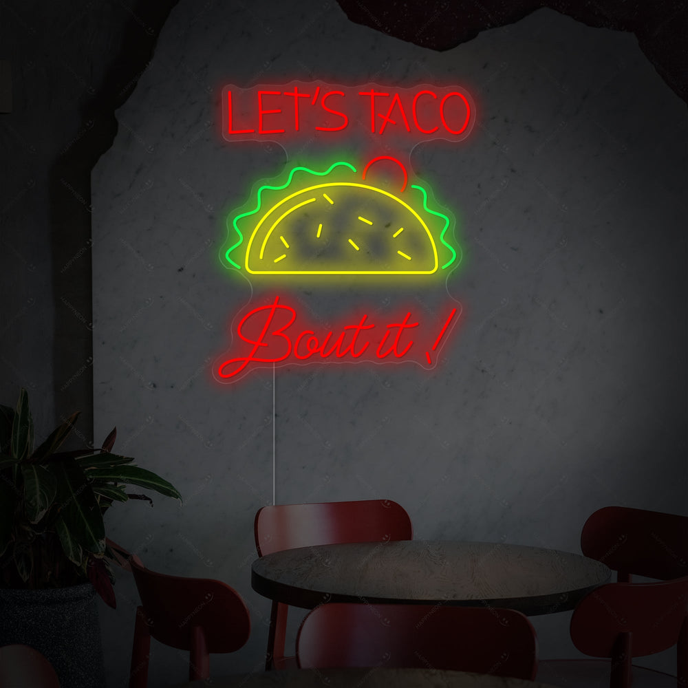 'Let's Taco Bout It' neon sign with a clear acrylic backing, ready for mounting as a piece of unique kitchen neon decor.
