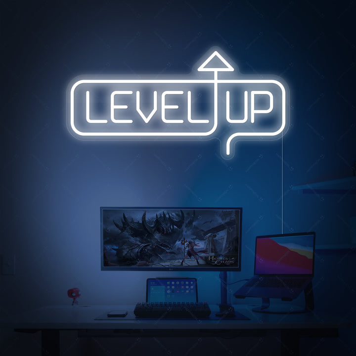 The 'Level Up' neon sign on a gray brick wall, casting a cool purple and orange glow in a modern game room.