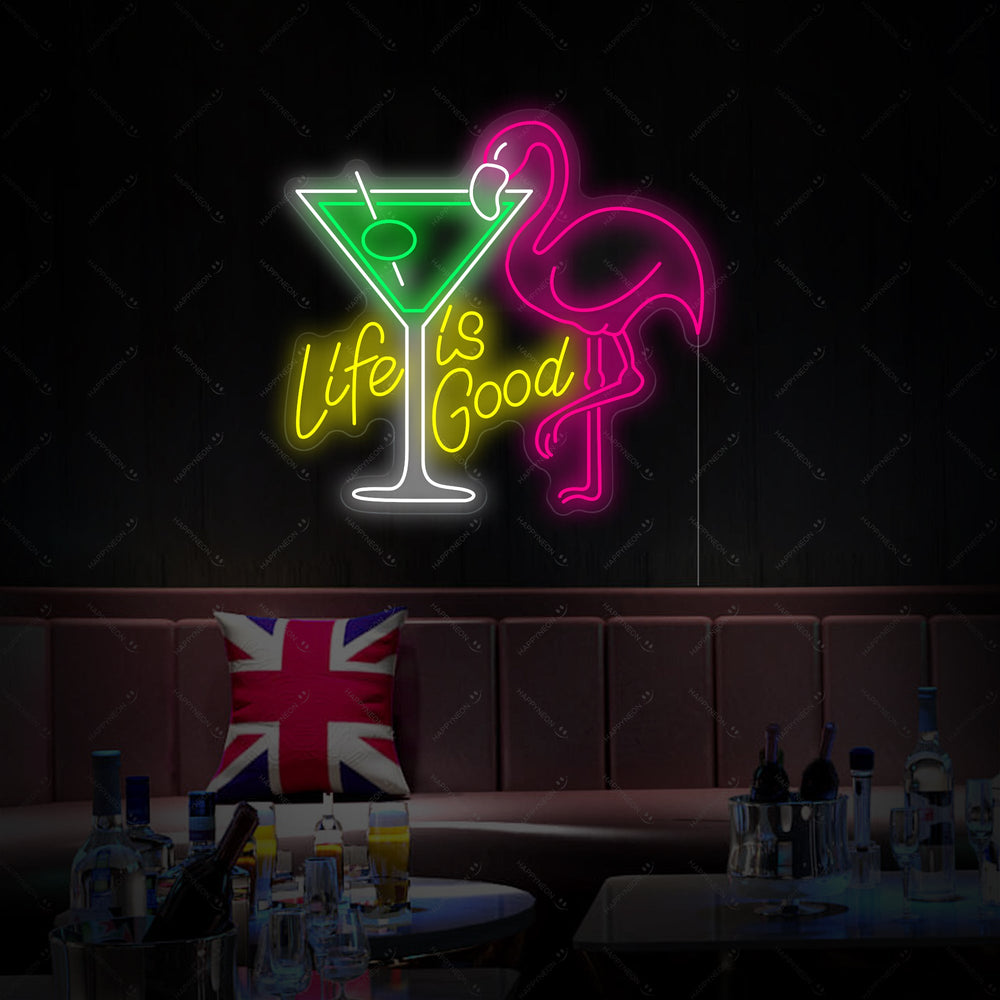 A close-up view of the unlit 'Life Is Good' flamingo and cocktail neon sign design.