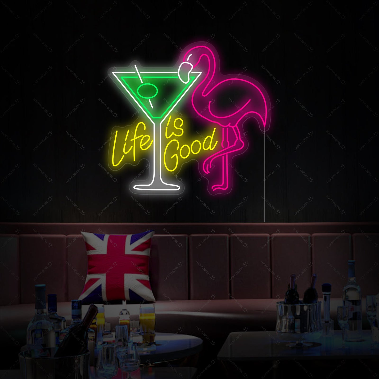 A close-up view of the unlit 'Life Is Good' flamingo and cocktail neon sign design.
