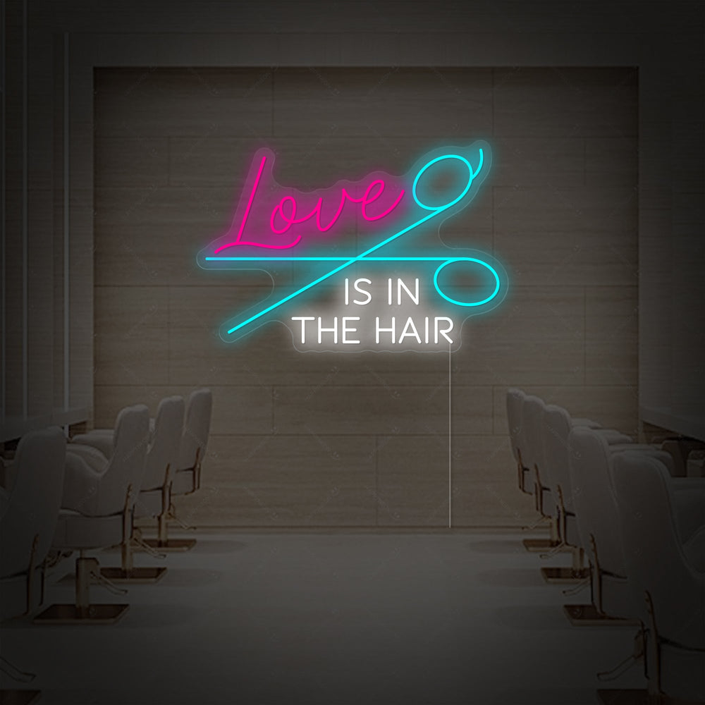 A graphic visualization of the 'Love Is In The Hair' neon sign design with clear backing, presented against an artistic, symmetrical hair studio backdrop.