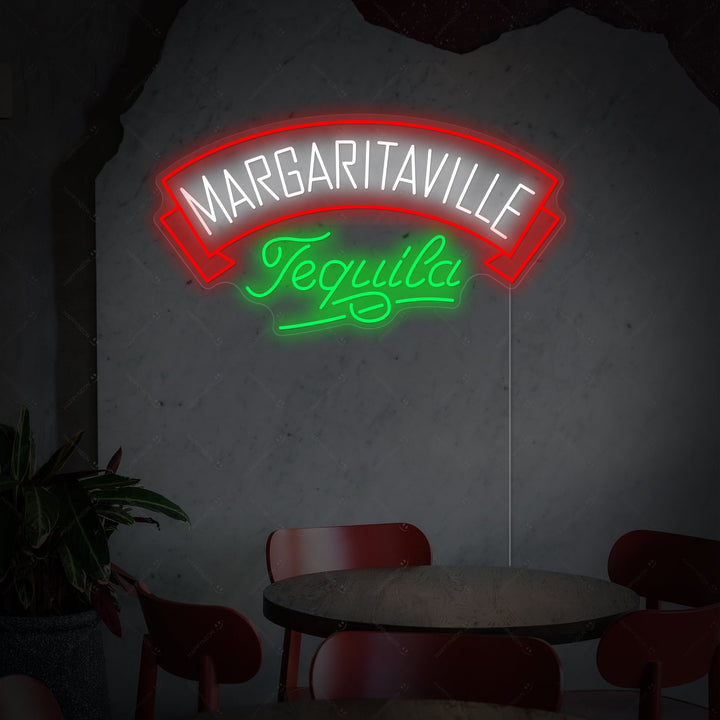 Vibrant blue and yellow 'Margaritaville Tequila' neon sign with an anchor logo, mounted in a cozy, blurred bar setting.