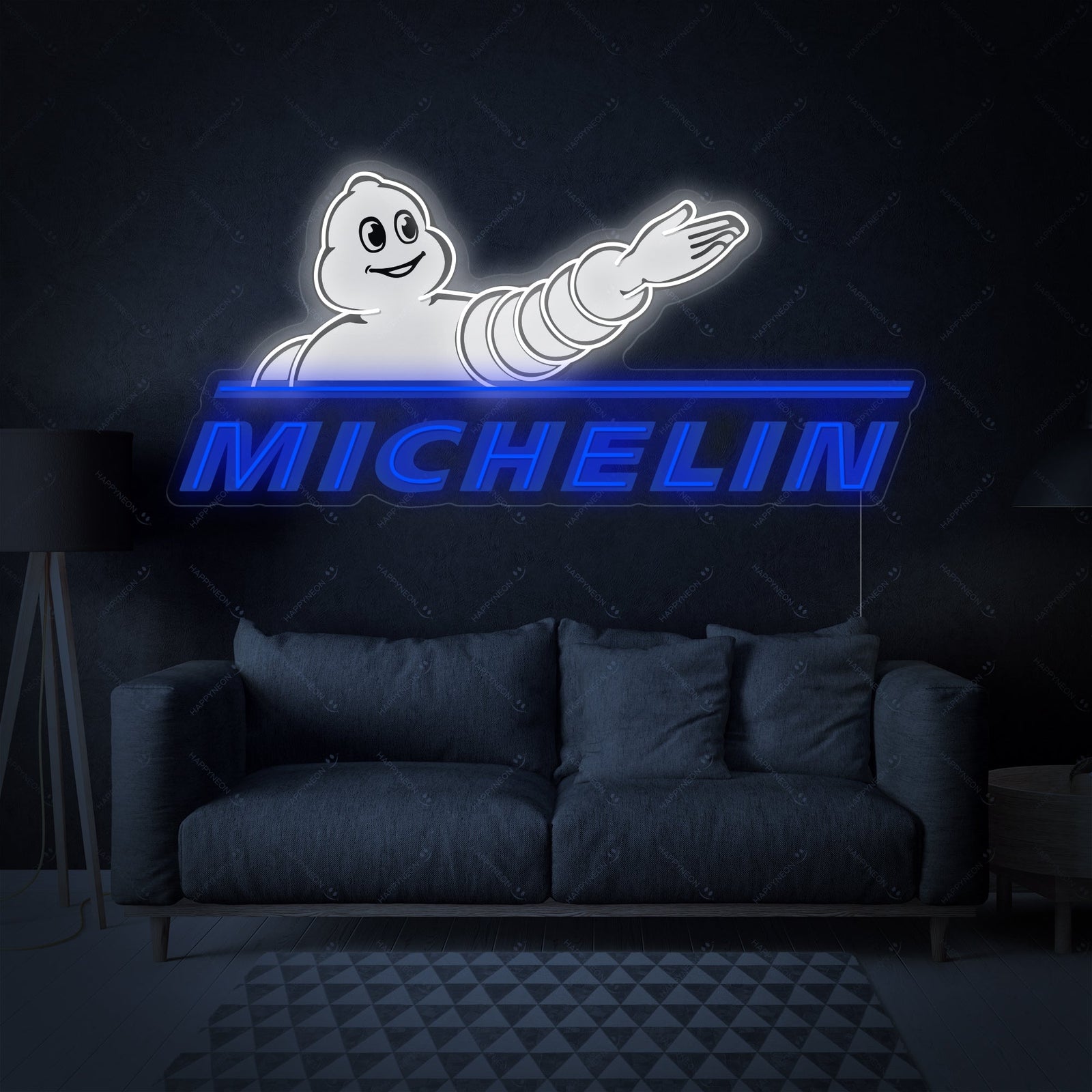 A Michelin logo neon sign hanging on a textured wall in a garage setting.