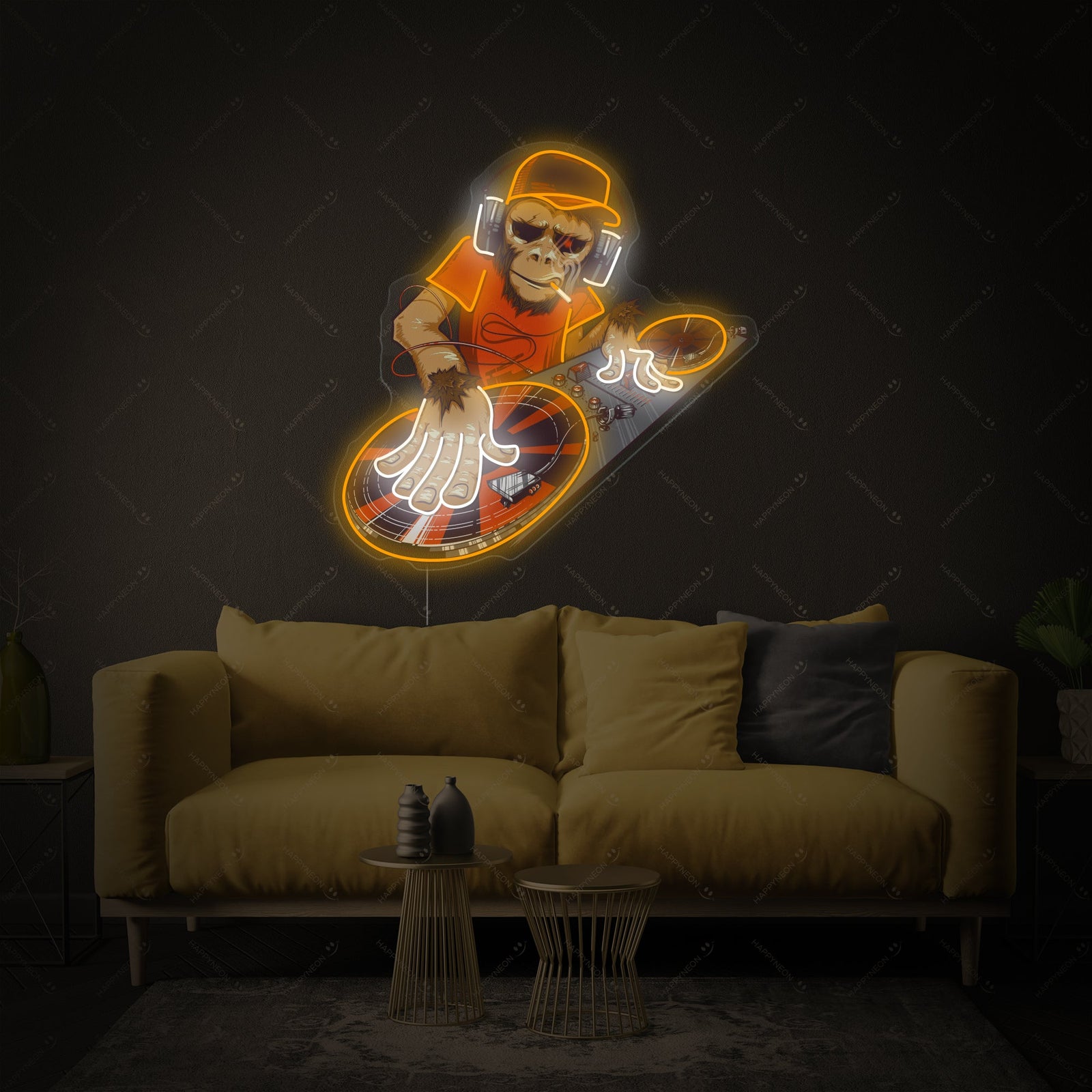Close-up photograph of the 'Monkey DJ' neon sign, showing the detailed glowing tubes in various colors and the illustration of a monkey DJ with headphones at a mixing desk on a clear acrylic backing.