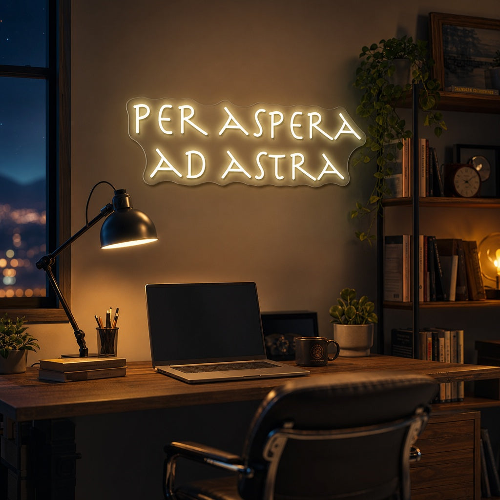 A room lit by the glowing Latin phrase 'PER ASPERA AD ASTRA' in modern neon, serving as motivational wall decor above a desk.