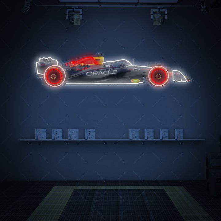 Detailed Rb F1 car neon-style sign featuring glowing outlines, vibrant team colors, and printed sponsor logos, displayed on a stylized wooden shelf.