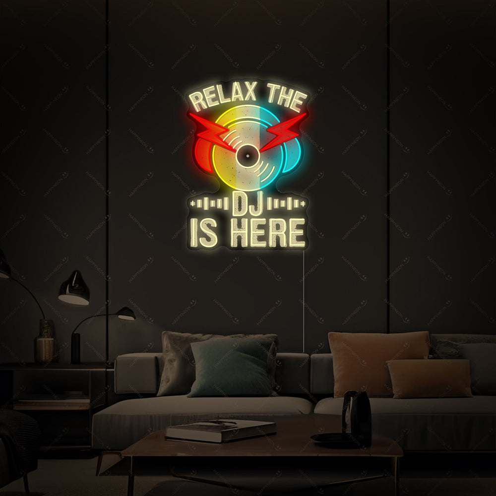 A stylish 'Relax The Dj Is Here' neon wall sign mounted on a clean backdrop in a contemporary studio environment.