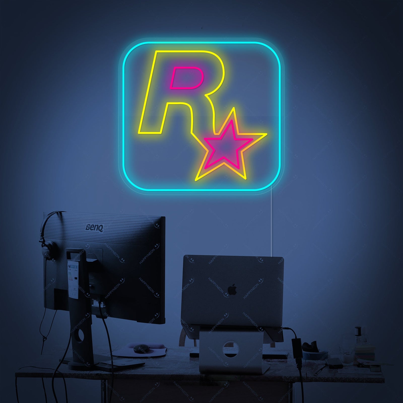 The iconic Rockstar Games logo depicted as a vibrant yellow neon sign with visible acrylic backing and electrical cord.