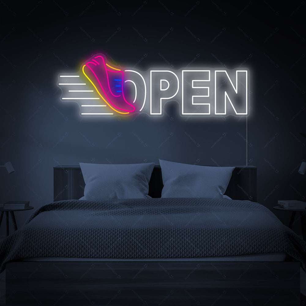 Running Shoes Open neon sign glowing brightly on a wall.