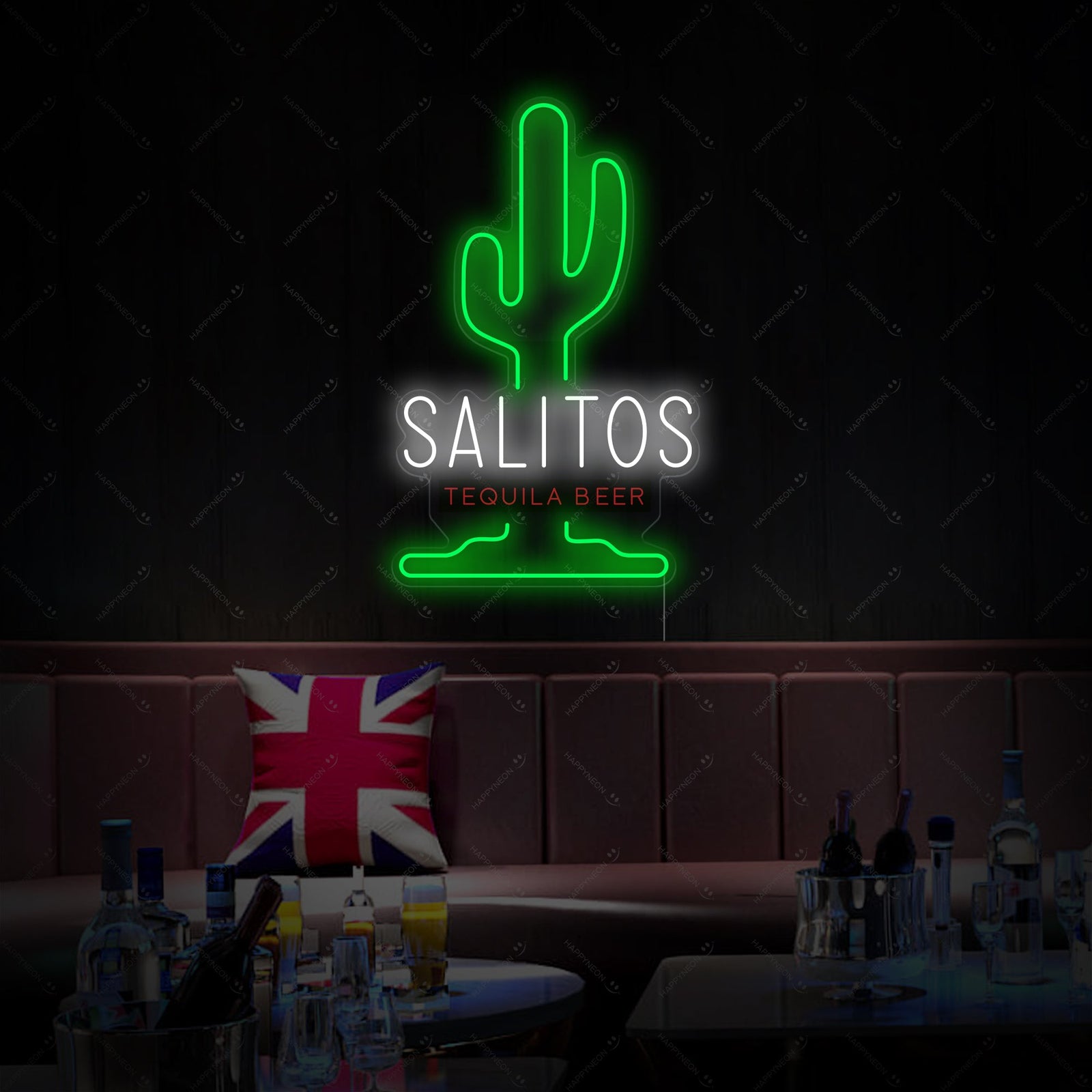 Product visualization of the Salitos Neon Sign graphic composited onto a realistic brick wall behind a wooden bar counter with beer taps, showing the design in context with watermarks.