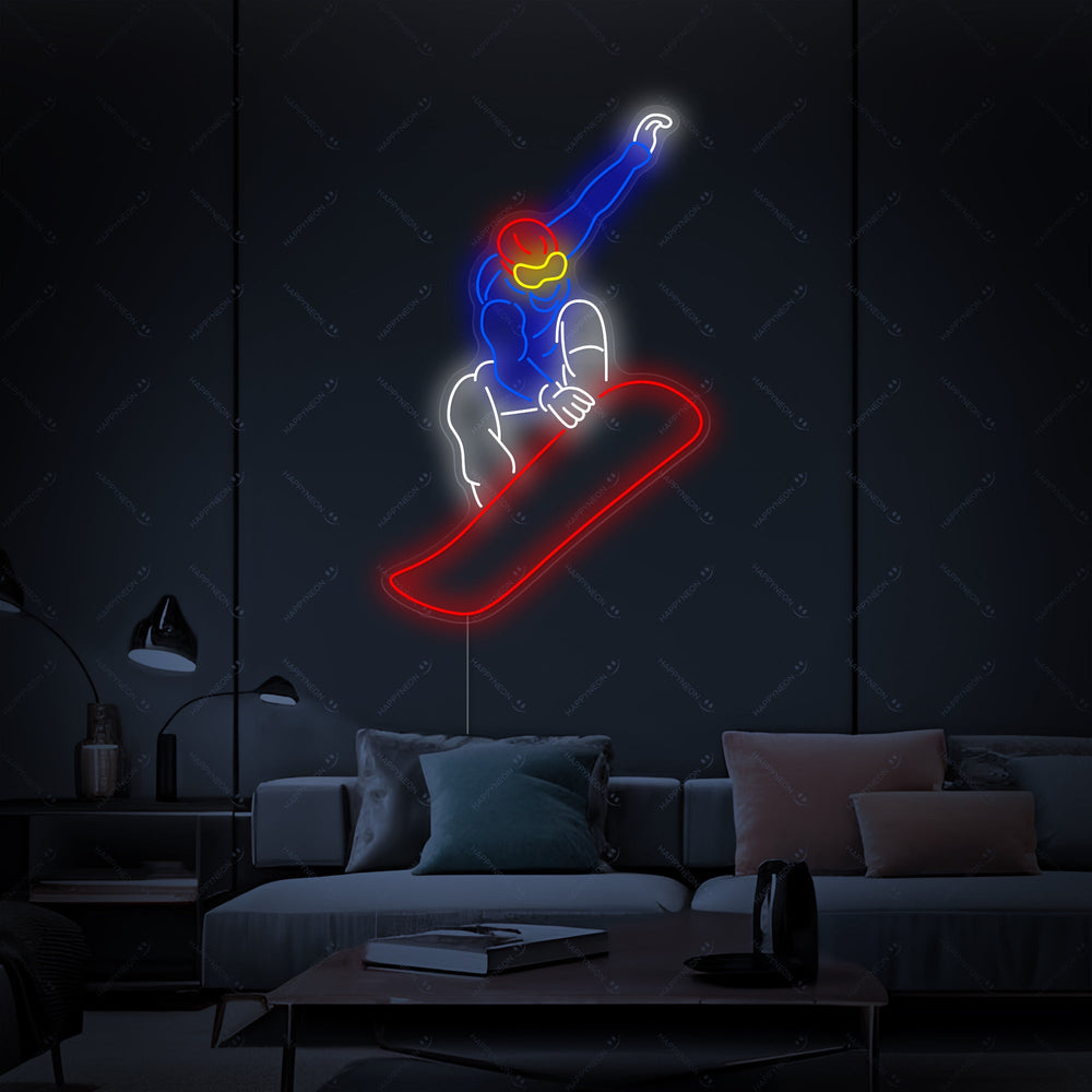 A close-up photograph of a Snowboarder neon sign glowing blue against a dark brick wall in a rustic, modern setting