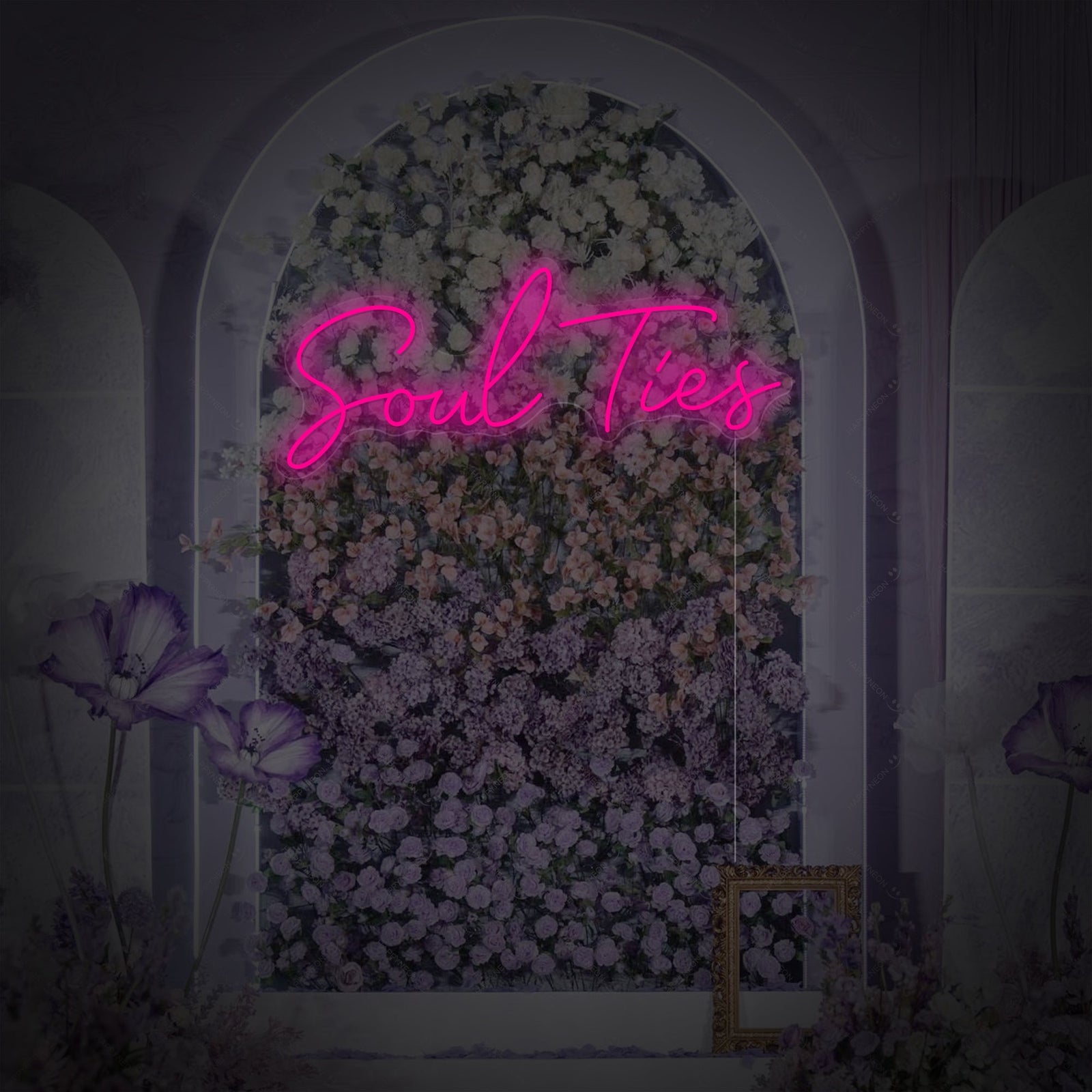 Close-up photograph of the Soul Ties neon wall decor, showcasing the sleek acrylic backing, detailed script font, and the power cord. The sign is subtly glowing, mounted on a rustic wooden wall with soft, blurry decorative lighting in the background.