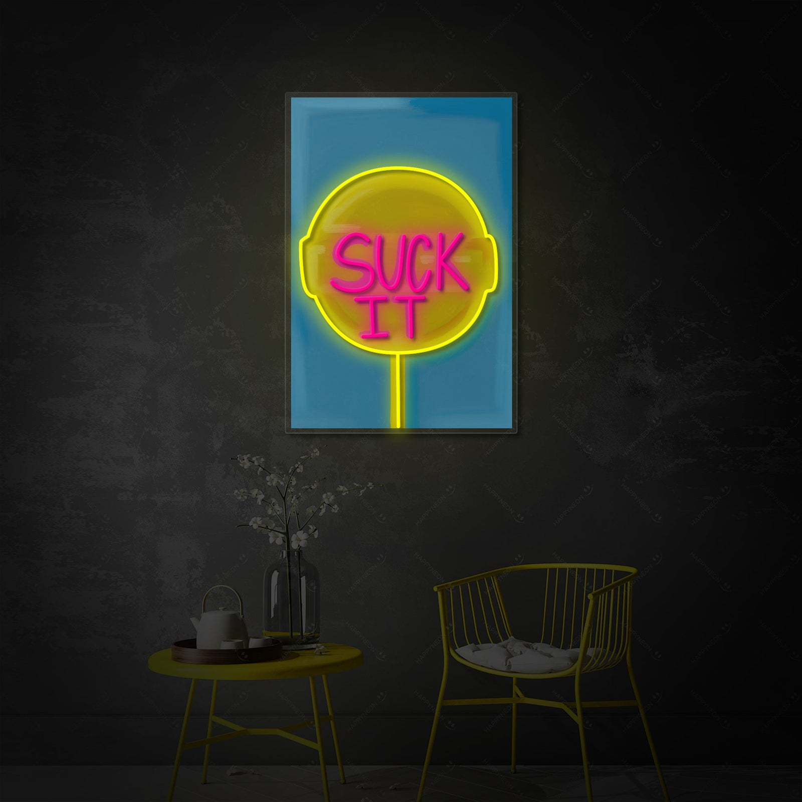 The 'Suck It Lollipop' neon sign glowing brightly on a brick wall, showcasing its pink and yellow swirl design and playful lettering in a modern living room setting.