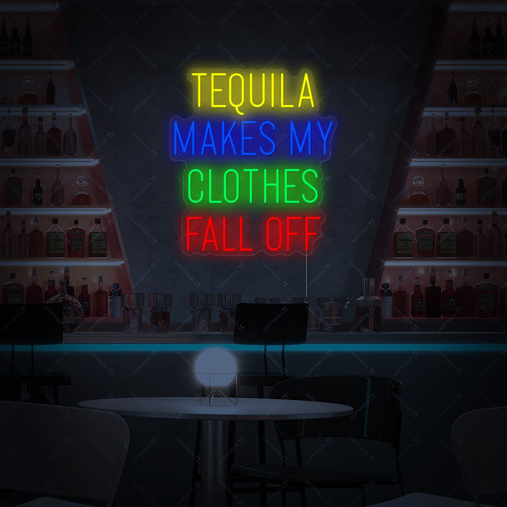 A 'Tequila Makes My Clothes Fall Off' neon sign displayed against a brick wall.