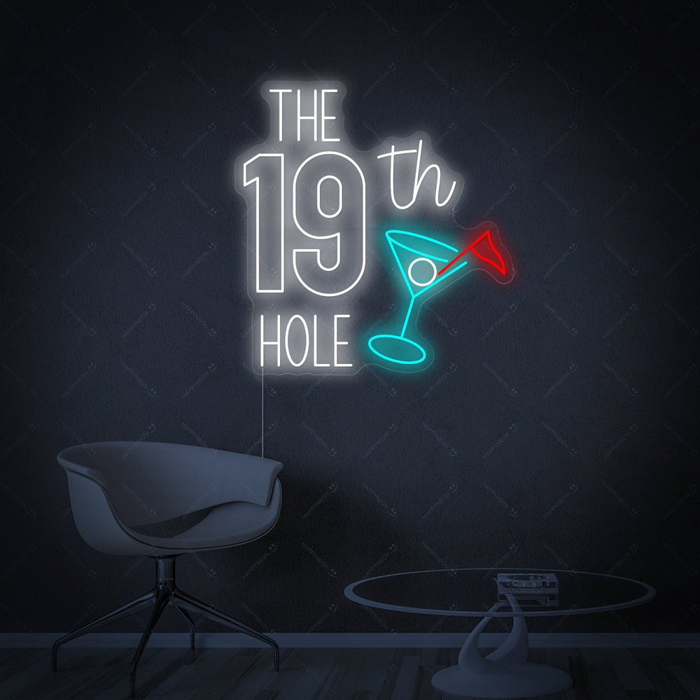The glowing 'The 19th Hole Golf' neon sign displayed prominently on a rustic brick wall, casting a warm white and green light in a cozy man cave with classic wooden furniture.