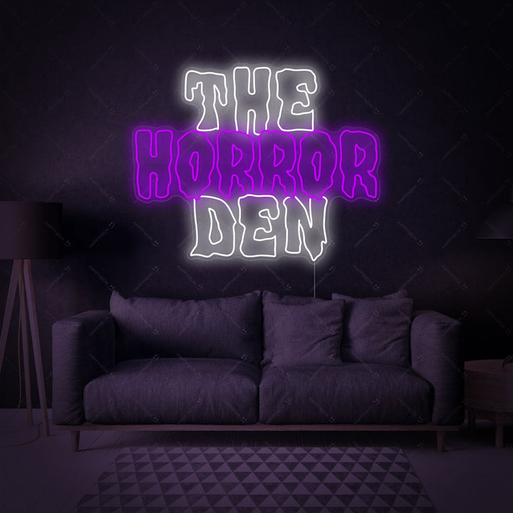 Closeup of the glowing red "The Horror Den" neon sign against a dark wall, showing realistic neon tubing details.