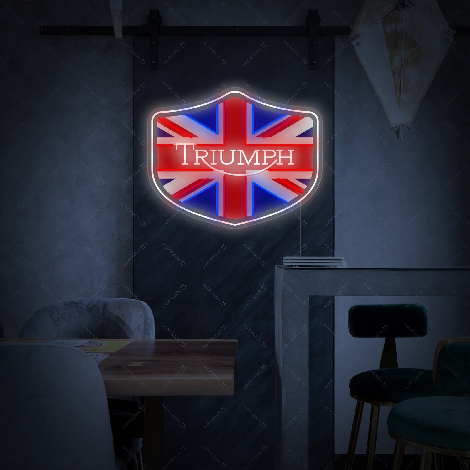 A glowing 'Triumph' logo neon sign featuring the iconic wings, presented against a stylized, modern brick wall setting.