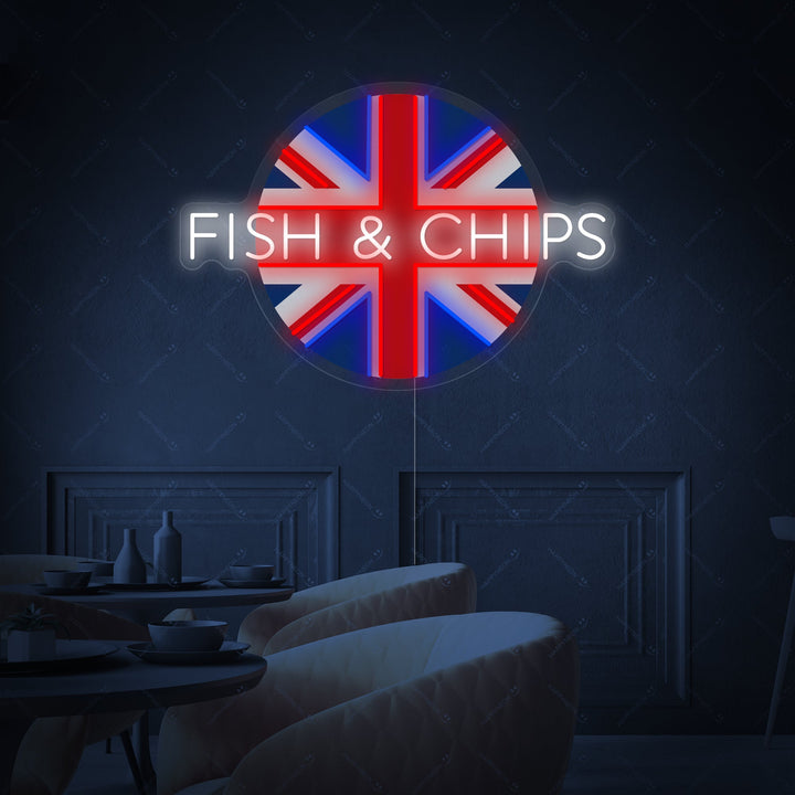 A close-up view of the UK Fish & Chips neon sign design featuring the illustrated fish and chips meal and decorative scroll text on a grey wall.