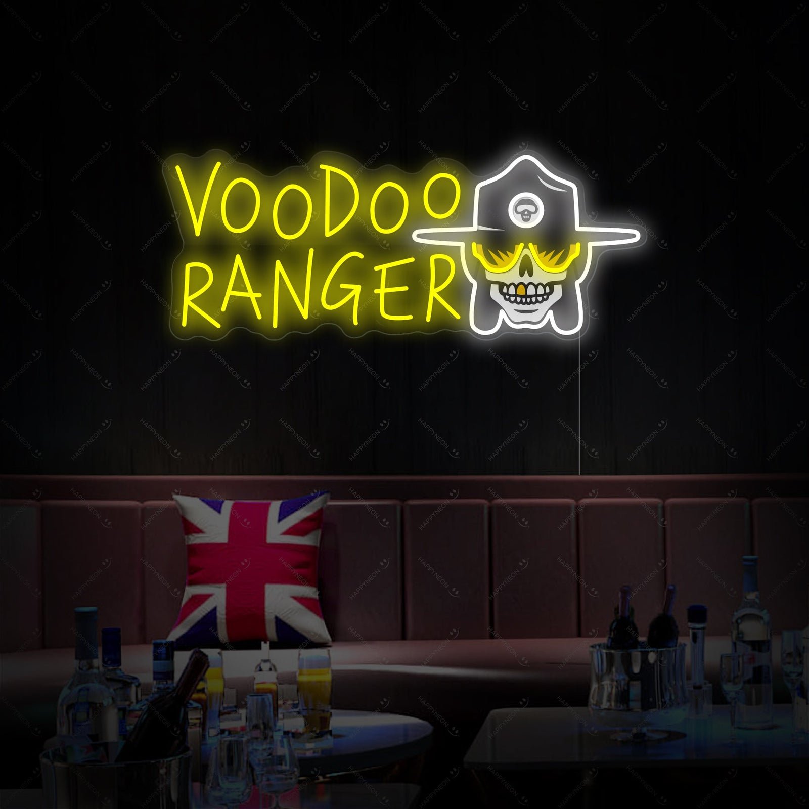 A wide-angle shot of the Voodoo Ranger neon sign installed on a wall in a lively bar setting, casting its light on the surroundings.