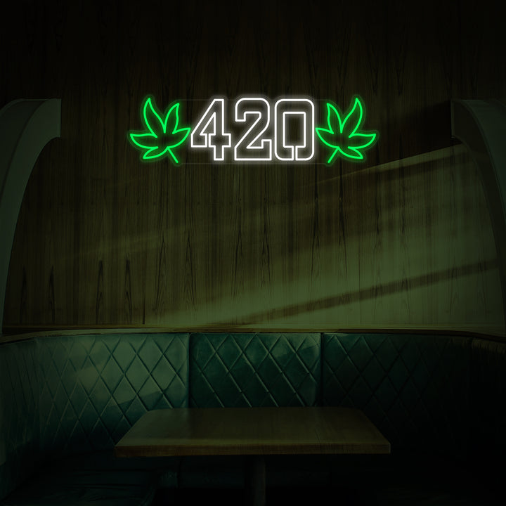 Vibrant green glowing LED neon sign of a stylized cannabis leaf and the word "420" lit up on a brick wall background, creating an aesthetic atmosphere.