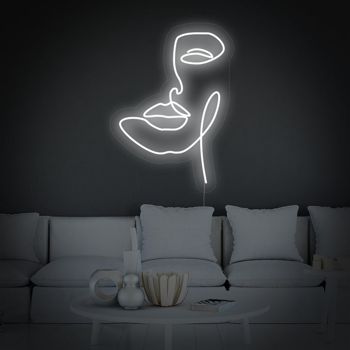 Close up of abstract women face neon sign glowing in white light
