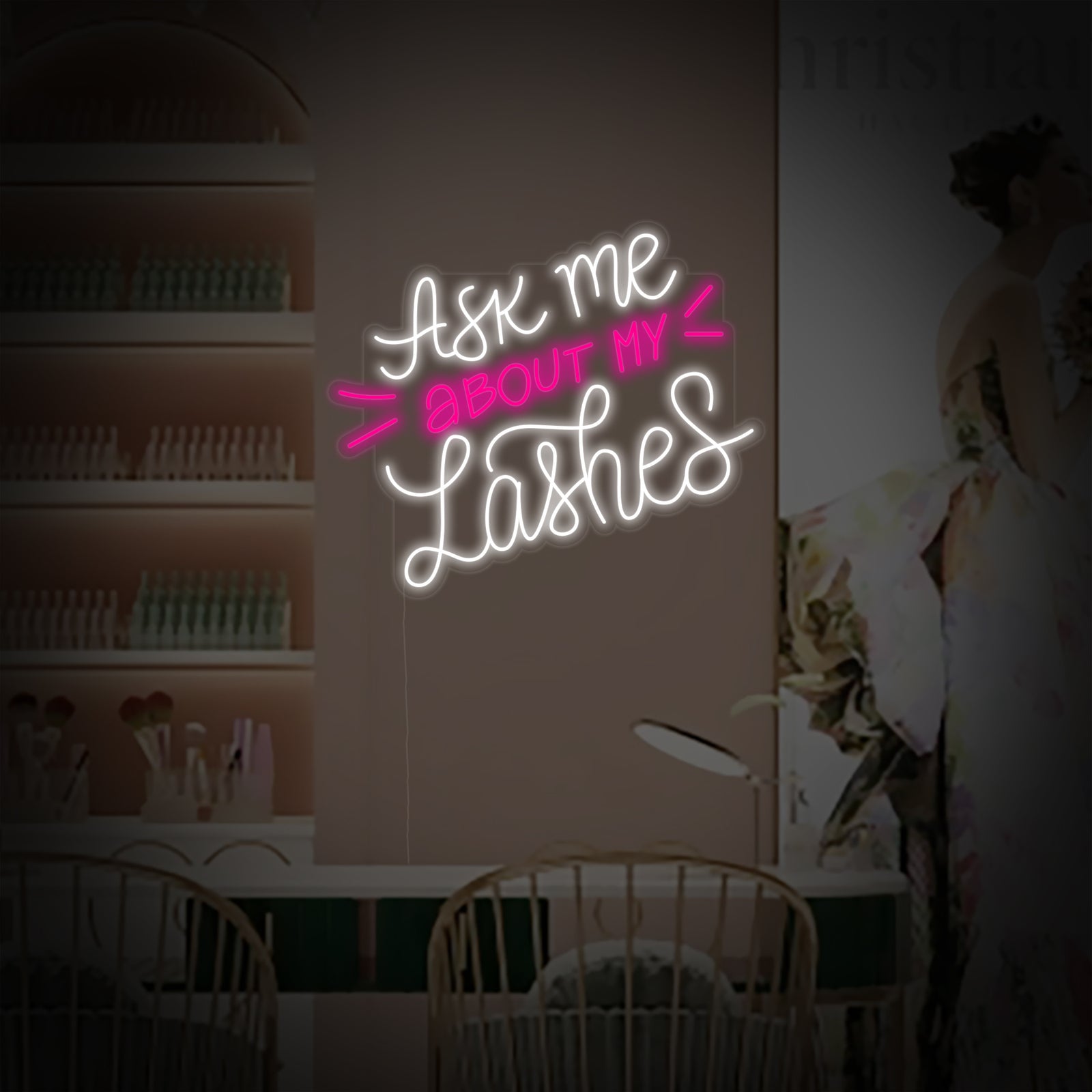 The glowing 'Ask Me About My Lashes' neon sign shown from a front perspective, highlighting the detailed script design.