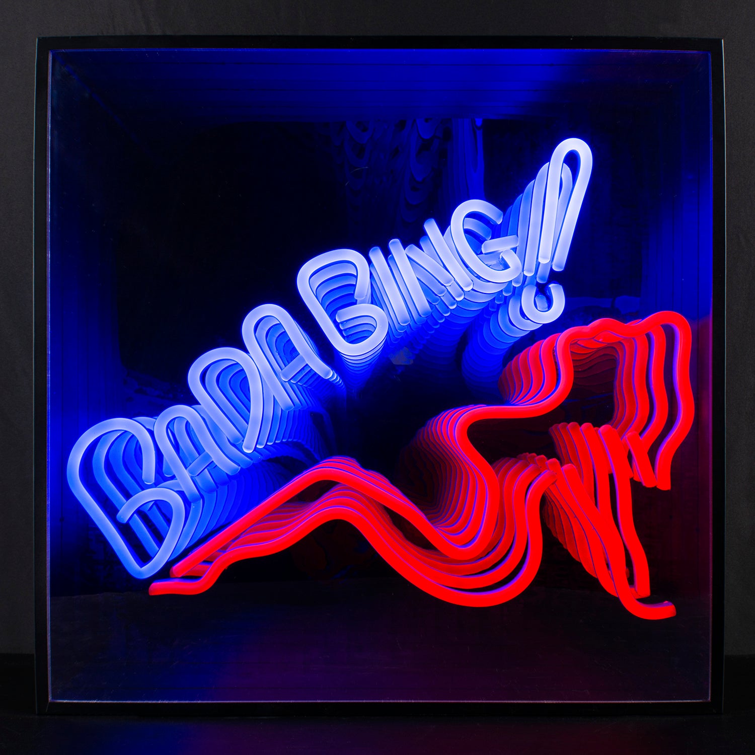 A photorealistic view of the Bada Bing 3D infinity neon sign glowing brightly with red neon script over an illusion of endless receding light layers in a dark room.